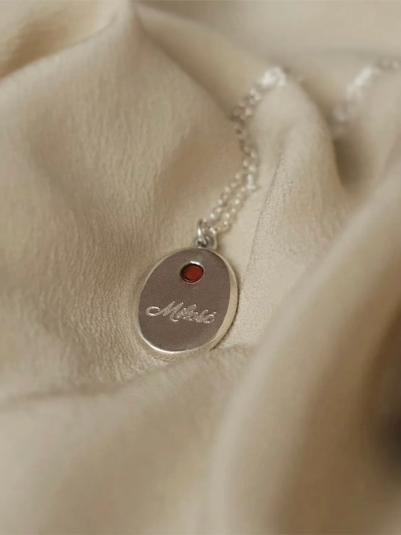 Oval silver pendant with cognac amber and engraving option