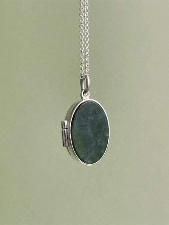 Sterling silver locket necklace with green stone