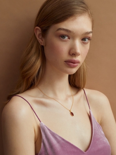 Gold-plated amber necklace worn on the neck