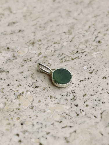 Small sterling silver pendant with natural green nephrite stone