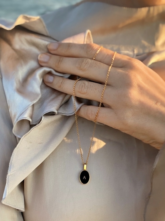 Personalized gold-plated amber necklace worn on the neck