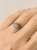 Sterling silver meteorite ring worn on hand, modern unisex jewelry with cosmic origin