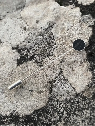 Elegant handmade lapel pin with dark stone